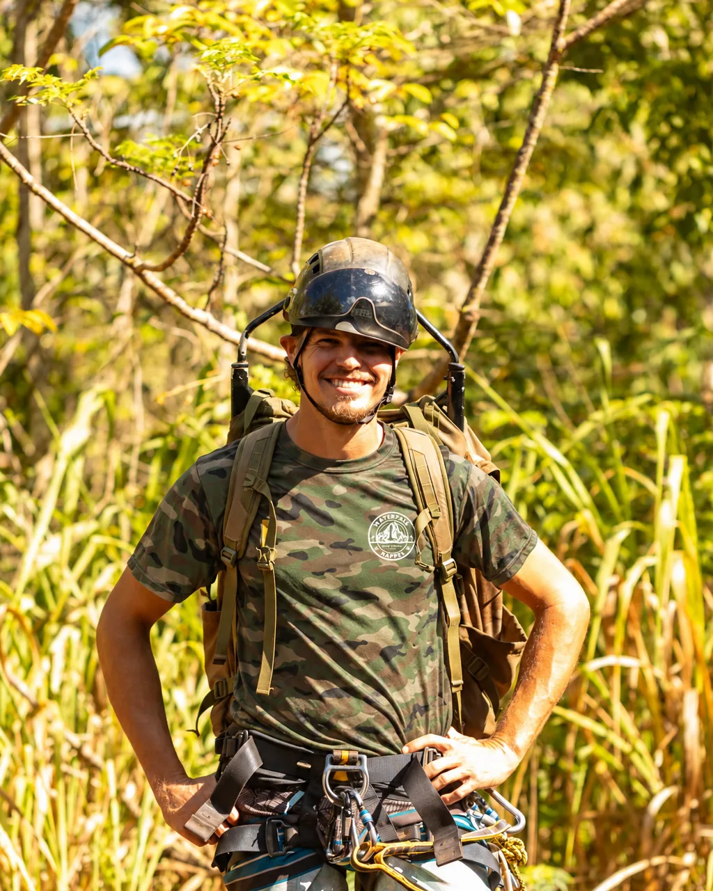 Matt in helmet and harness on the jungle trail